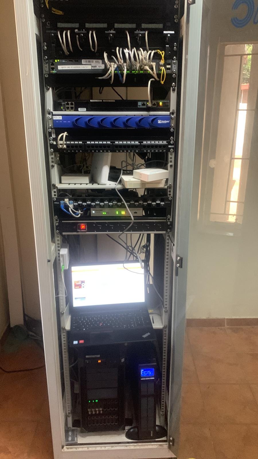 Completed office communications rack with switching, UPS and a console